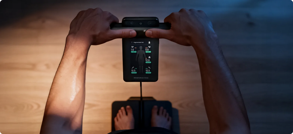 People holding the MorphoScan Nova body composition scale